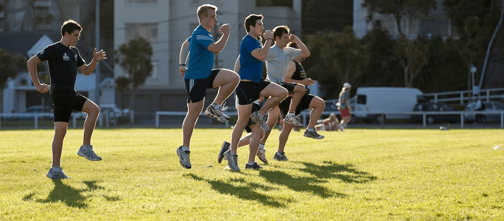 A group performing running form drills