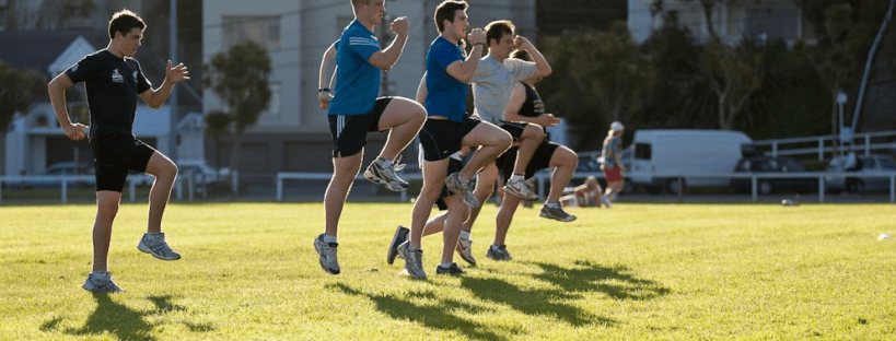 A group performing running form drills